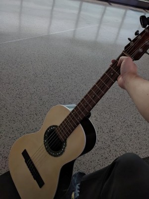 I found a nice view of the ocean in Oakland Airport.  While I'm a pretty bad guitar player, it was a beautiful place to charge my phone and play guitar.