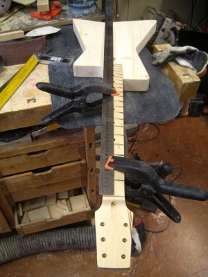 After routing the neck pocket I measured the distances for the bridge and the pickups with a steel ruler.